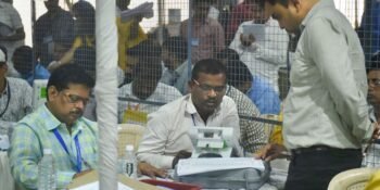 Election officials carry out counting of votes for the Mumbai