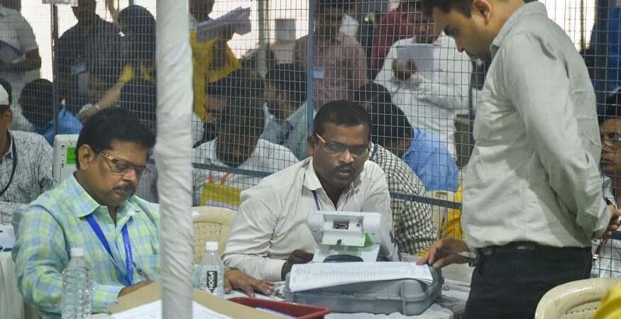Election officials carry out counting of votes for the Mumbai